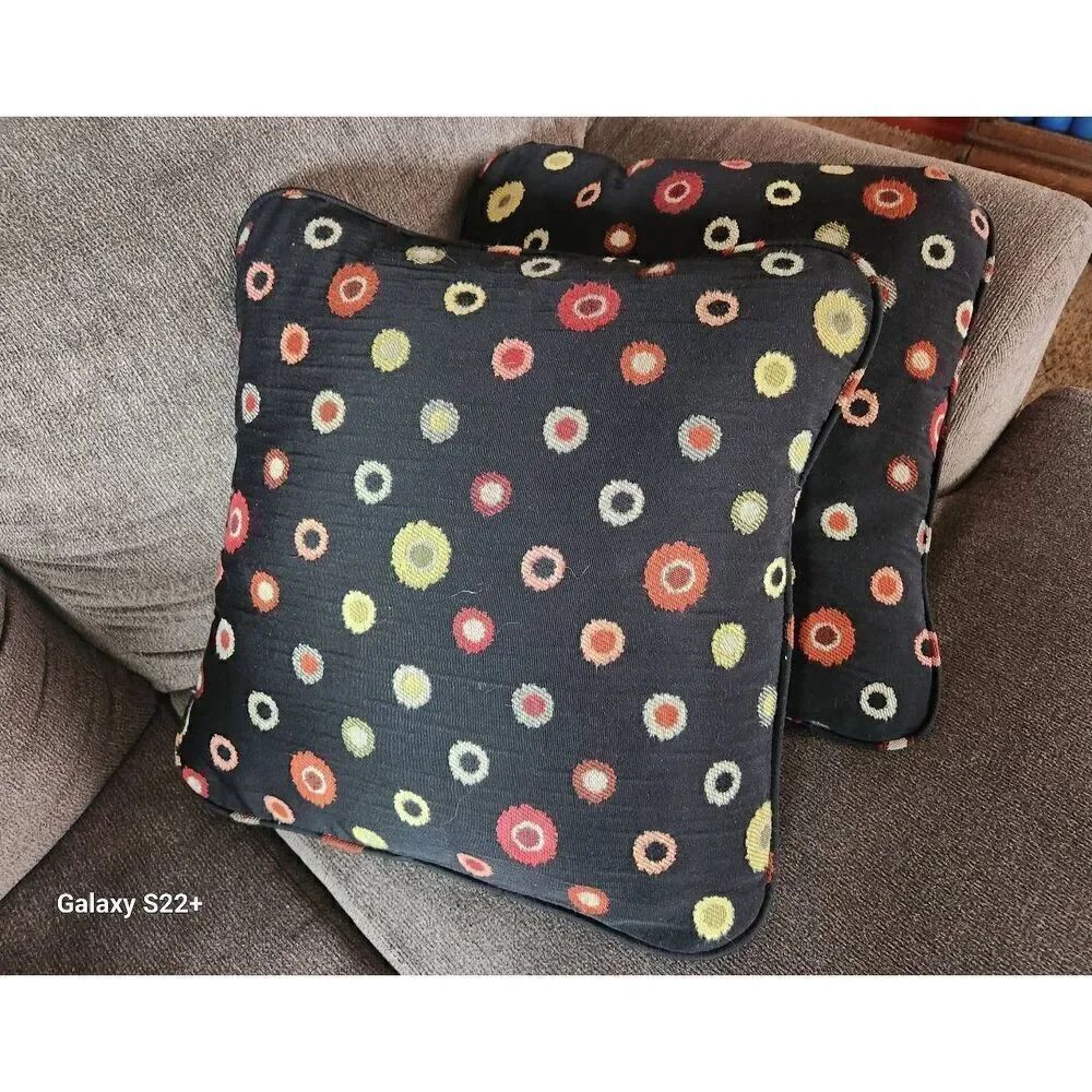 Throw pillows, black with multi-colored pattern